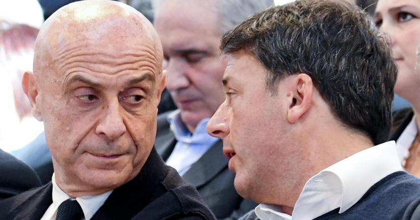Marco Minniti con Matteo Renzi (Ansa)