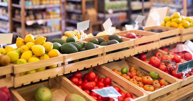 Fresh vegetables and fruits on counter in a grocery supermarket JackF - stock.adobe.com
