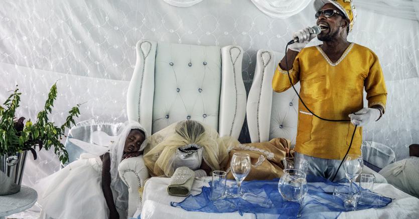 Jonas Bendiksen, Moses Hlongwane, otherwise known simply as Jesus, giving a sermon during his wedding to Angel, one of his disciples. In Moses' theology, his wedding day was the start of the End of Days. South Africa, 2016. Courtesy of Jonas Bendiksen/Magnum Photos