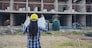 Woman construction engineer hold blueprint wear plaid shirt safety white hard hat at construction site industry labor worker. Architecture Female engineer civil worker look at blueprint real estate