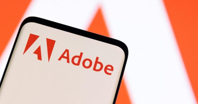 FILE PHOTO: Adobe logo is seen on smartphone in this illustration taken June 13, 2022. REUTERS/Dado Ruvic/Illustration/File Photo
