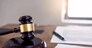 Symbol of Judge law attorney gavel with Justice lawyers table desktop, workplace with documents