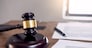 Symbol of Judge law attorney gavel with Justice lawyers table desktop, workplace with documents