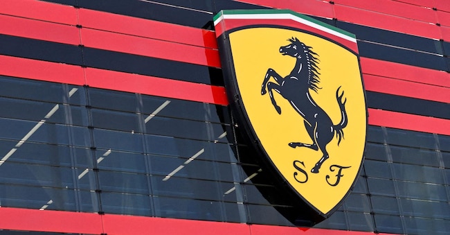 FILE PHOTO: The logo of Ferrari is seen in the headquarters as CEO Benedetto Vigna unveils the company's new long term strategy, in Maranello, Italy, June 15, 2022. REUTERS/Flavio Lo Scalzo/File Photo