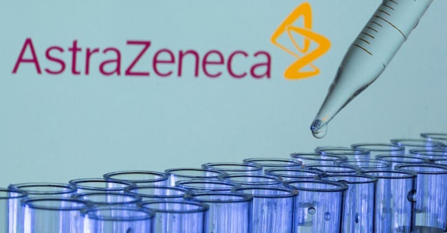 FILE PHOTO: Test tubes are seen in front of a displayed AstraZeneca logo in this illustration taken, May 21, 2021. REUTERS/Dado Ruvic/Illustration/File Photo