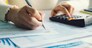  Closeup woman filling form of Individual Income Tax Return,