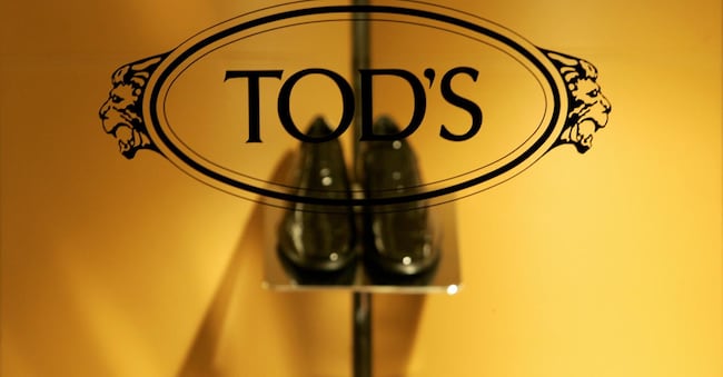 Tod's logo is pictured on a window of an Italian fashion designer's shop in central Milan, 12 December 2006. AFP PHOTO / Filippo MONTEFORTE / AFP / FILIPPO MONTEFORTE