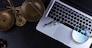 Workspace hero header with wooden law gavel, scale and laptop keyboard, top view, copy space on desktop