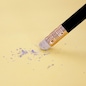 Pencil eraser removing a written mistake on a piece of paper, delete, correct, and mistake concept.