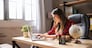 Girl works at home with a laptop