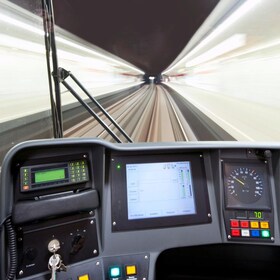 The cockpit of a modern subway, as it drives through a station