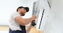 Service man is cleaning, repair and maintenance of air conditioner