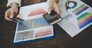 Woman holding credit card and using smart phone for online shopping with vintage tone.