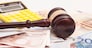 Judge gavel, euro banknotes and calculator