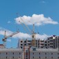 Construction site with many cranes against the sky