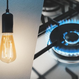 Gas stove and light bulb. Utility bills concept. Composition