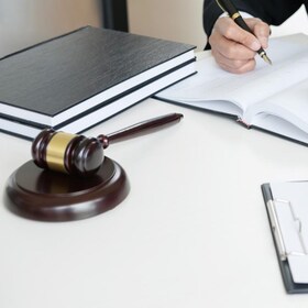 Judge gavel with legal documents, lawyer consulting with business man