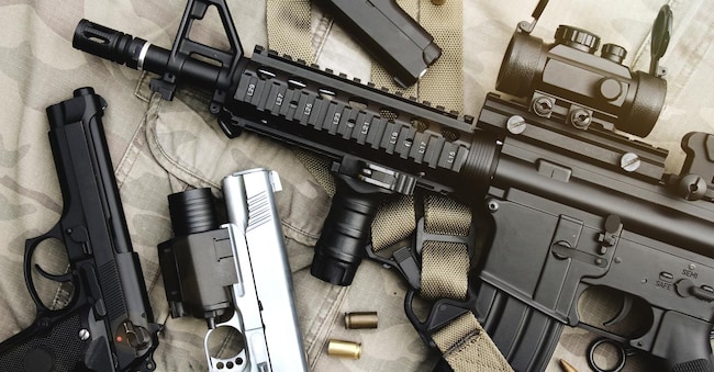 Weapons and military equipment for army, Assault rifle gun (M4A1) and pistol on camouflage background.