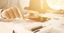 Business man analysis data document with accountant using calculator