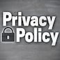 Privacy Policy on concrete wall background.