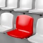 Unique red seat among white ones