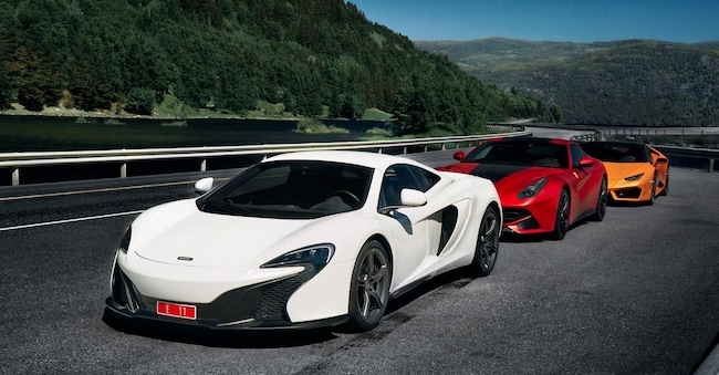 Miland, Norway. 04.06.2016: white Mclaren 650s, red Ferrari F12 and yellow Lamborghini Huracan