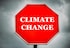 Creative Sign-Stop Climate Change with dark clouds.