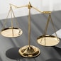 Shiny golden balanced scale and law book on desk in law school as concept justice and legal symbol. Scale balance for righteous and equality judgment by lawyer and attorney. equility