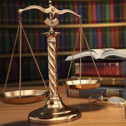 Justice concept. Gavel,  golden scales and books in the library with dof effect. 3d
