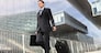 businessman walking with trolley and bag, business travel