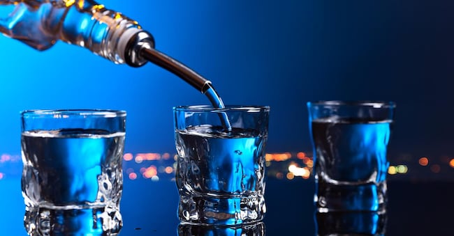 vodka in bar on a black reflective background
