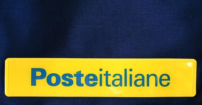 A picture shows the logo of the Poste Italiane, the Italian postal service provider, on February 1, 2024 in Rome. Meloni's hard-right government aims to raise 20 billion euros ($21.6 billion) by 2026 by selling off a stake in Poste Italiane, which turns big profits through its insurance and banking operations, as well as stakes in rail company Ferrovie dello Stato and energy giant Eni. (Photo by Alberto PIZZOLI / AFP)