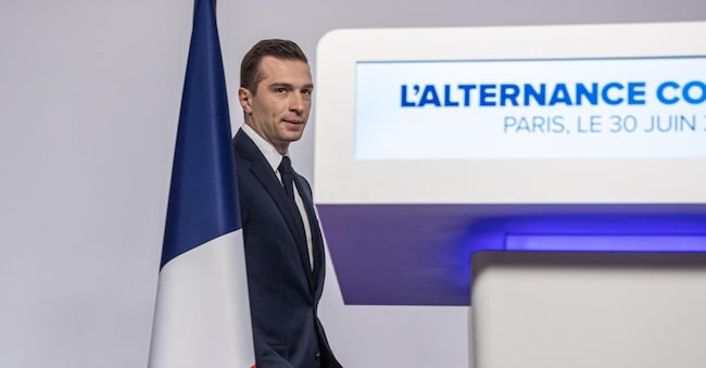 epa11448578 President of the French right-wing party National Rally (Rassemblement National, RN) Jordan Bardella arrives to deliver a speech after preliminary results of the first round of the French parliamentary elections, in Paris, France, 30 June 2024. 'The French people have met their responsibilities and confirmed their clear desire for change', said Bardella during the press conference as France's far right National Rally, according to exit polls, has made significant gains in the first round of parliamentary elections. Bardella also said he would be prime minister 'of all the French people' if the far right wins an 'absolute majority' in the second round of elections next week.  EPA/CHRISTOPHE PETIT TESSON