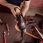 beautiful repaired shoes in man's hands. close up top view photo