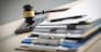 Judge hammer and business report papers, important documents