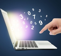 Man typing on notebook with number comming out, hand push digital data with computer network on blue background, business technology concept.