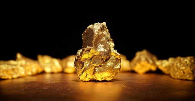 Closeup of big gold nugget finance concept