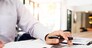 Accountant or banker calculating balance. finances investment economy saving money or insurance concept
