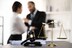 Balanced scale of justice and gavel hammer in focus on blurred background of lawyer colleagues discuss and plan for lawsuit in law firm office, as legal representatives. Equilibrium