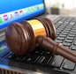 Online internet auction. Gavel on laptop.  3d