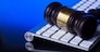Wooden law gawel on computer keyboard, internet auction concept