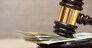 Law gavel on a stack of American money
