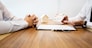 Real Estate agent showing a contract signature with customer to making a valuation deal