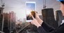 Asian business engineer architecture professional woman, wearing safety helmet and use smartphone to capture construction site for working and presenting job concept