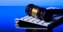 Wooden law gawel on computer keyboard, internet auction concept