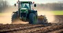 A farmer in a tractor prepares the ground. As part of pre seeding chores in the early spring season of agricultural labor. Generative AI