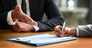 Business people, hands and contract or signature for deal, partnership and legal paperwork, law firm and night office. Paper, client advice and lawyer person, notary or partner writing and agreement.