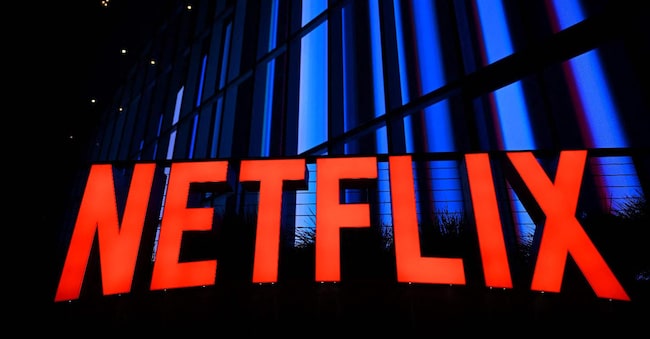 (FILES) The Netflix logo is seen at the Netflix Tudum Theater in Los Angeles, California, on September 14, 2022. Netflix said on October 17, 2024 it added more than 5 million subscribers in the recently ended quarter but signalled slowing growth. The streaming juggernaut said it ended September with 282.7 million subscribers, reporting a profit of $2.4 billion on revenue that jumped 15 percent to $9.8 billion compared with the same period a year earlier. (Photo by Patrick T. FALLON / AFP)
