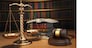 Justice concept. Gavel,  golden scales and books in the library with dof effect. 3d