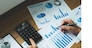 Businessmen are pointing numbers, graph, chart in business results. Business concept.